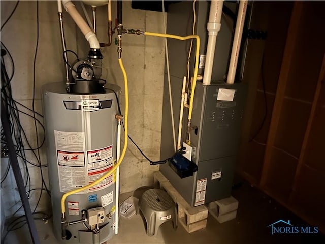 2440 Bluestone Dr, Findlay, OH 45840 - utility room featuring water heater and heating unit