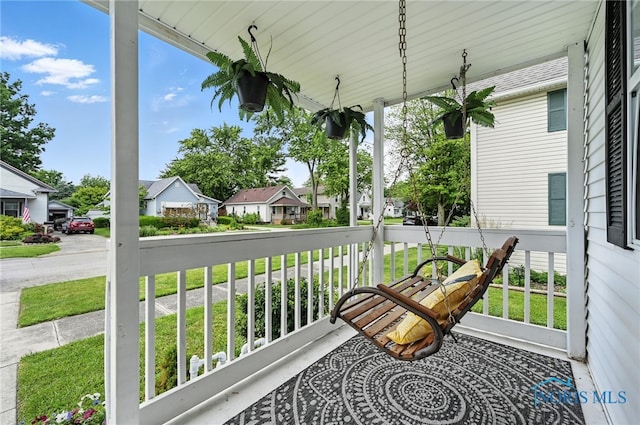 634 Cherry St, Findlay, OH 45840 - covered porch featuring a residential view