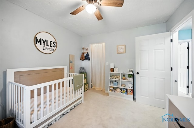 634 Cherry St, Findlay, OH 45840 - bedroom featuring a nursery area, carpet, and a ceiling fan