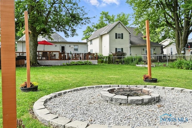 634 Cherry St, Findlay, OH 45840 - rear view of property featuring a fire pit and a wooden deck