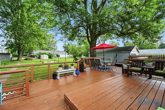 634 Cherry St, Findlay, OH 45840 - deck with outdoor dining space and an outdoor structure