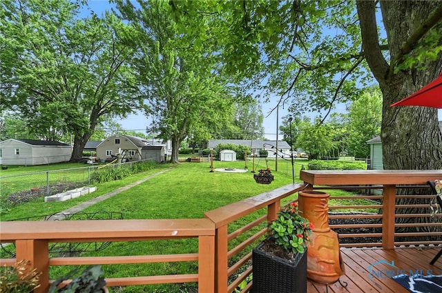 634 Cherry St, Findlay, OH 45840 - wooden terrace featuring a fenced backyard and a shed
