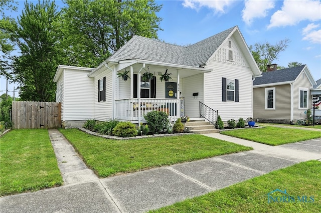634 Cherry St, Findlay, OH 45840 - view of front facade featuring covered porch and roof with shingles