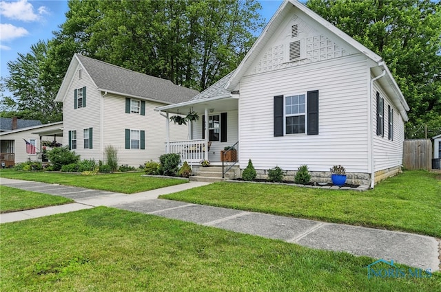 634 Cherry St, Findlay, OH 45840 - view of front facade with a porch and a front yard