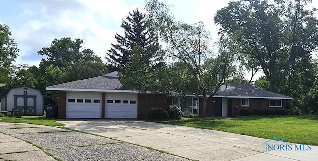 4010 Wreford Ct, Toledo, OH 43614 - single story home featuring concrete driveway, a front yard, an attached garage, a storage unit, and brick siding