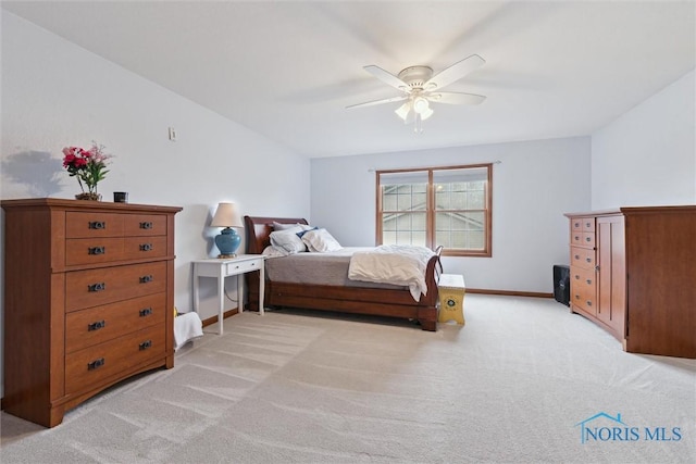 2393 Woods Edge Rd, Perrysburg, OH 43551 - bedroom with light colored carpet and a ceiling fan