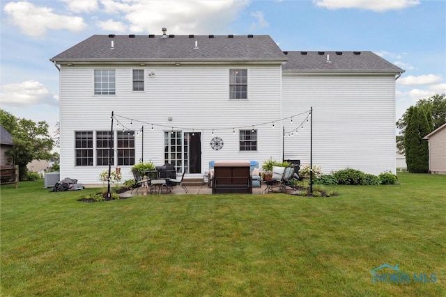 2393 Woods Edge Rd, Perrysburg, OH 43551 - back of property featuring a patio area, a yard, and an outdoor hangout area