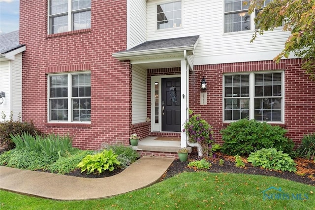 2393 Woods Edge Rd, Perrysburg, OH 43551 - view of exterior entry featuring brick siding