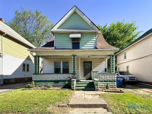 1534 Indiana Ave, Toledo, OH 43607 - view of front of property featuring covered porch and a front lawn