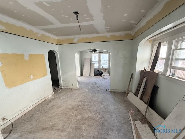1534 Indiana Ave, Toledo, OH 43607 - empty room with arched walkways and ceiling fan