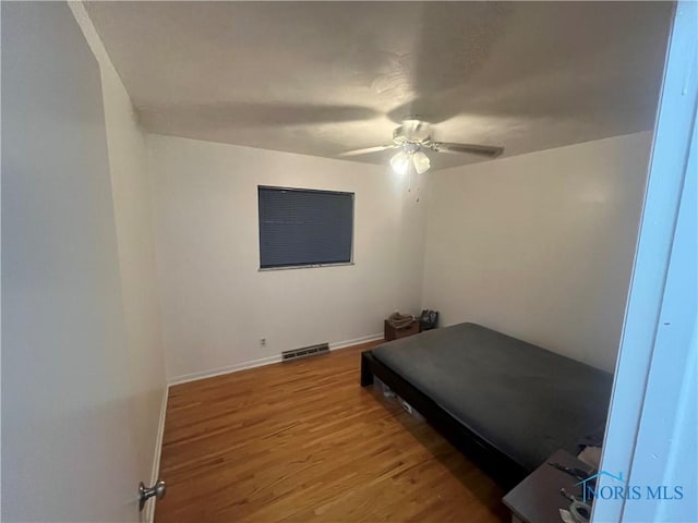 4409 Merry Ln, Toledo, OH 43615 - bedroom with wood finished floors and ceiling fan