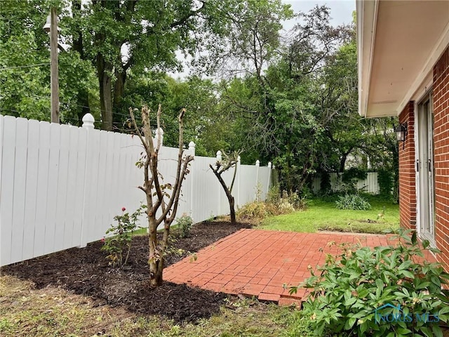 4409 Merry Ln, Toledo, OH 43615 - fenced backyard with a patio area