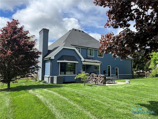 7106 Country Creek Rd, Maumee, OH 43537 - back of property with a patio area, a chimney, and roof with shingles