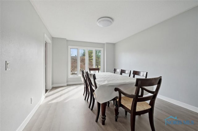 7106 Country Creek Rd, Maumee, OH 43537 - dining room featuring wood finished floors and baseboards
