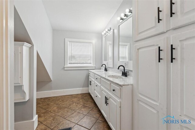 108 Western Ave, Findlay, OH 45840 - bathroom featuring double vanity and tile patterned flooring