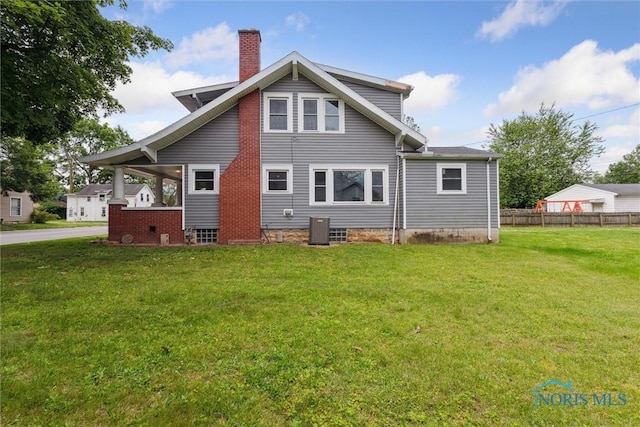 108 Western Ave, Findlay, OH 45840 - rear view of house featuring a chimney