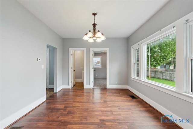 108 Western Ave, Findlay, OH 45840 - unfurnished dining area featuring a chandelier and wood finished floors