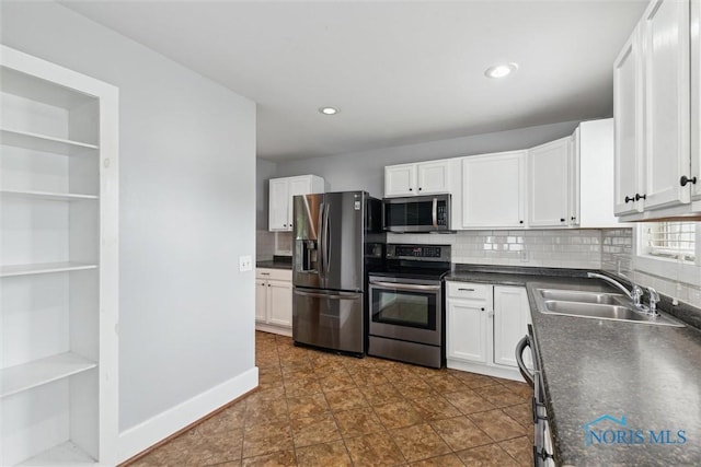 108 Western Ave, Findlay, OH 45840 - kitchen with stainless steel appliances, open shelves, dark countertops, backsplash, and recessed lighting