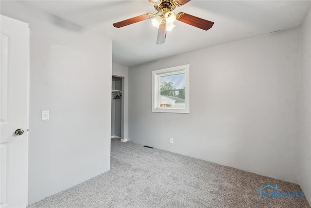 108 Western Ave, Findlay, OH 45840 - unfurnished bedroom featuring carpet floors, a closet, and ceiling fan