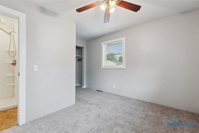 108 Western Ave, Findlay, OH 45840 - unfurnished bedroom featuring carpet flooring, a closet, and a ceiling fan