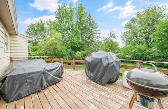 616 Normandie Blvd, Bowling Green, OH 43402 - wooden deck featuring area for grilling and view of wooded area