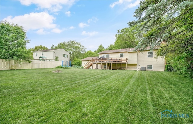 616 Normandie Blvd, Bowling Green, OH 43402 - view of yard with a trampoline, stairway, and a deck