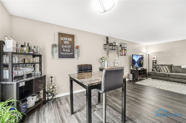 616 Normandie Blvd, Bowling Green, OH 43402 - dining space with wood finished floors and baseboards
