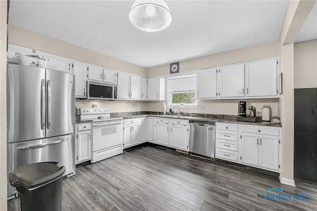 616 Normandie Blvd, Bowling Green, OH 43402 - kitchen with stainless steel appliances, white cabinetry, and dark countertops