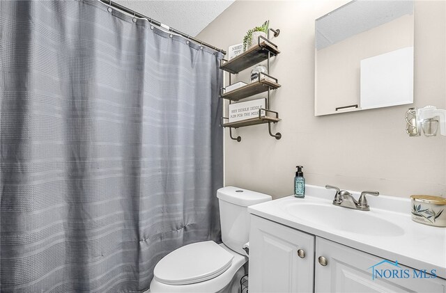 616 Normandie Blvd, Bowling Green, OH 43402 - bathroom with a textured ceiling and vanity