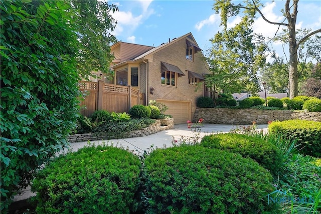 3998 W Bancroft St, Ottawa Hills, OH 43606 - view of home's exterior with concrete driveway, brick siding, and an attached garage