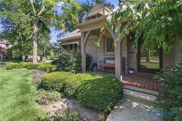 3998 W Bancroft St, Ottawa Hills, OH 43606 - view of side of home with brick siding and covered porch