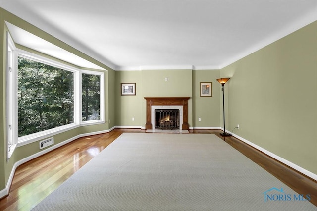 3998 W Bancroft St, Ottawa Hills, OH 43606 - unfurnished living room with wood finished floors and a tile fireplace