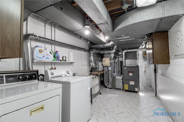 3998 W Bancroft St, Ottawa Hills, OH 43606 - laundry room featuring washer and clothes dryer, light marble finish floors, and heating unit