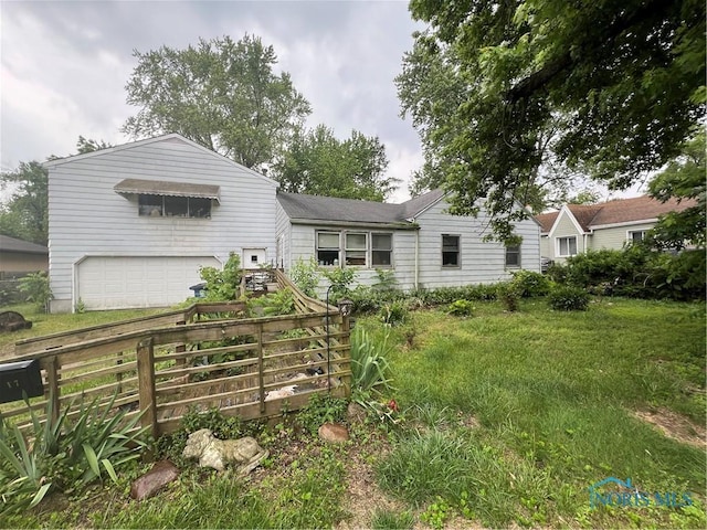2017 Newport Ave, Toledo, OH 43613 - back of house featuring an attached garage