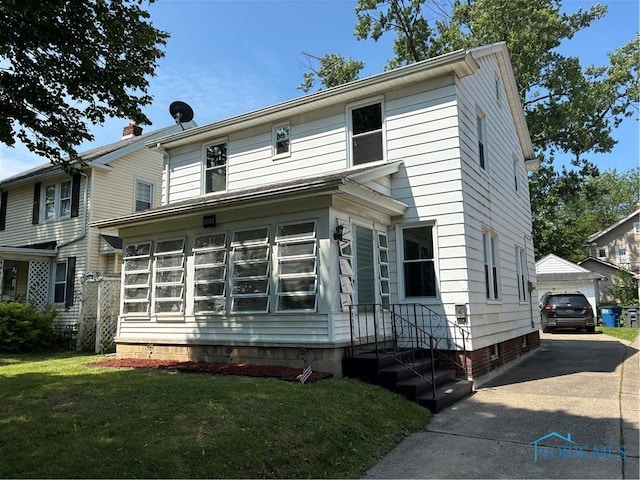 4033 Eastway St, Toledo, OH 43612 - traditional style home with crawl space, a garage, an outbuilding, and a front yard