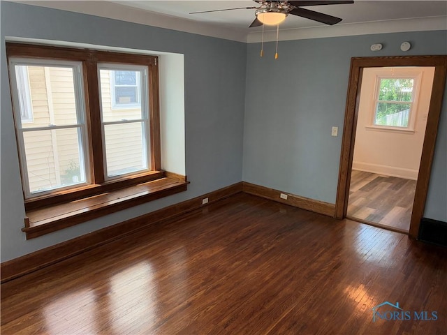 4033 Eastway St, Toledo, OH 43612 - unfurnished room featuring ceiling fan, dark wood-style flooring, and a smoke detector