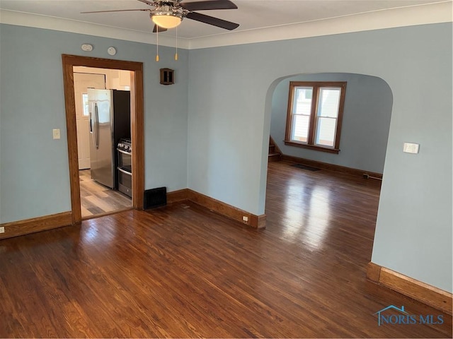 4033 Eastway St, Toledo, OH 43612 - spare room with a ceiling fan, arched walkways, wood finished floors, a smoke detector, and crown molding