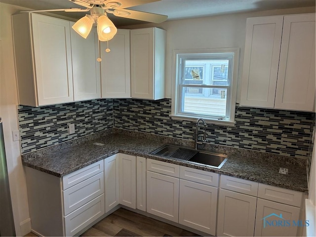 4033 Eastway St, Toledo, OH 43612 - kitchen featuring a ceiling fan, white cabinetry, backsplash, and dark wood-type flooring