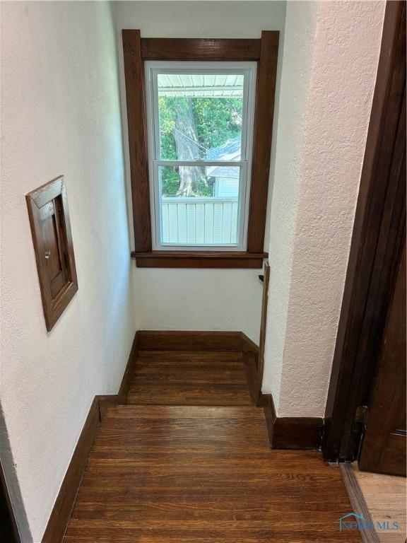 4033 Eastway St, Toledo, OH 43612 - staircase featuring wood finished floors and a textured wall