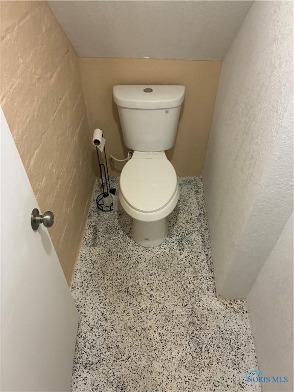 4033 Eastway St, Toledo, OH 43612 - bathroom featuring toilet and speckled floor