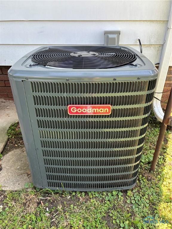 4033 Eastway St, Toledo, OH 43612 - exterior view of a central AC unit and crawl space