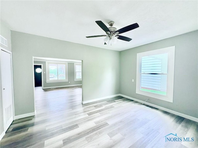 127 W Maumee Ave, Napoleon, OH 43545 - empty room with light wood-type flooring and ceiling fan