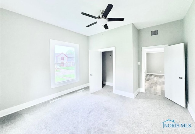 127 W Maumee Ave, Napoleon, OH 43545 - unfurnished bedroom featuring carpet floors and a ceiling fan