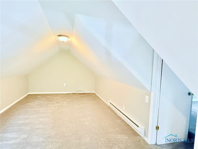 127 W Maumee Ave, Napoleon, OH 43545 - bonus room featuring a baseboard heating unit, vaulted ceiling, and carpet