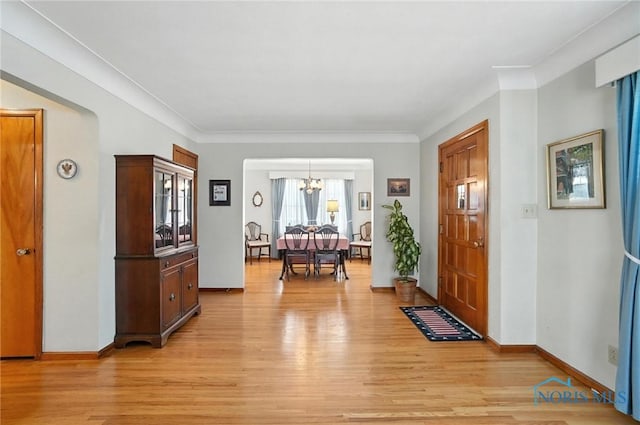 2632 117th St, Toledo, OH 43611 - foyer entrance featuring a chandelier and light wood finished floors