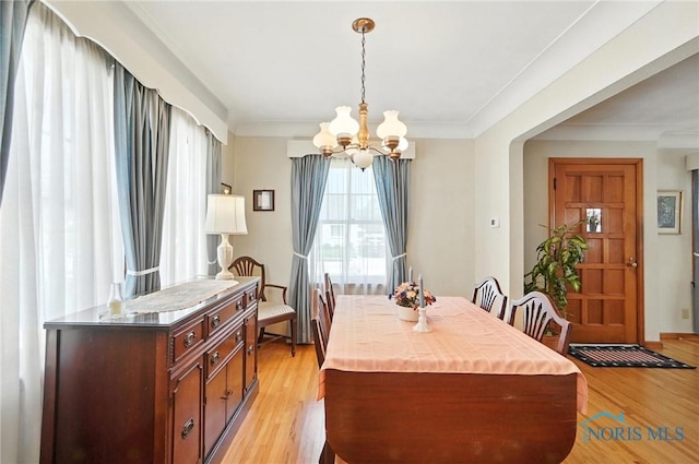 2632 117th St, Toledo, OH 43611 - dining room featuring a chandelier, light wood-style floors, and ornamental molding