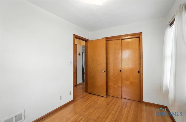2632 117th St, Toledo, OH 43611 - unfurnished bedroom featuring light wood-type flooring and a closet