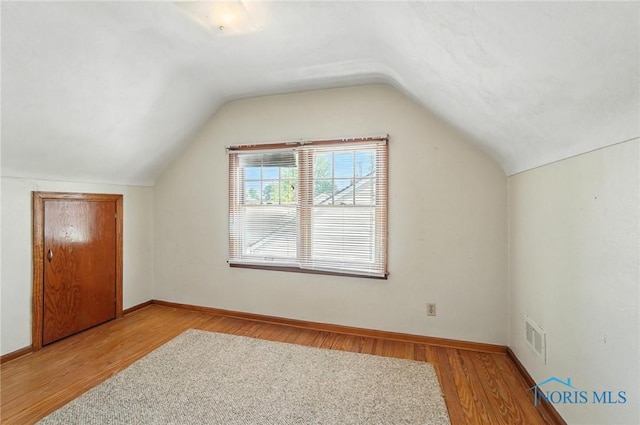 2632 117th St, Toledo, OH 43611 - additional living space with wood finished floors and lofted ceiling