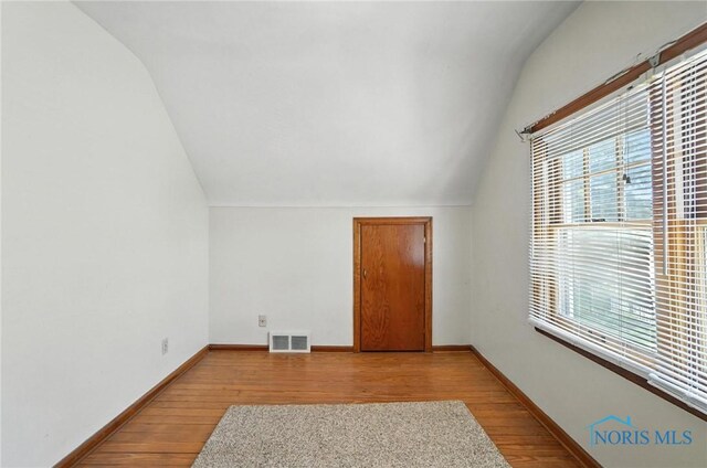 2632 117th St, Toledo, OH 43611 - bonus room with lofted ceiling, plenty of natural light, and wood finished floors