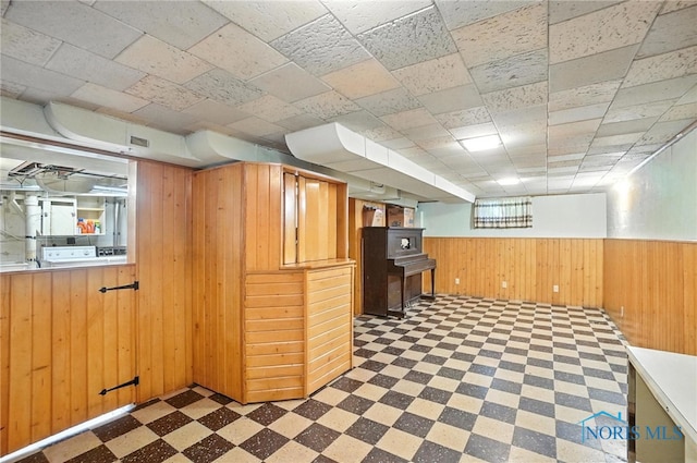 2632 117th St, Toledo, OH 43611 - below grade area featuring tile patterned floors, wood walls, and wainscoting